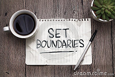 Set boundaries, text words typography written on paper against wooden background, life and business motivational inspirational Stock Photo