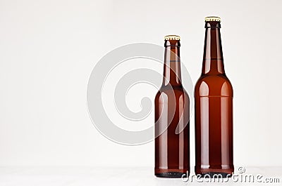 Set of brown longneck beer bottles 500ml and 330ml mock up. Stock Photo