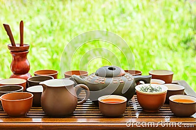 Set of Chinese Japanese Tea Cups Pot Bowls Utensils on Bamboo Wooden Dripping Tray. Preparing Ceremony. Cozy Atmosphere Stock Photo