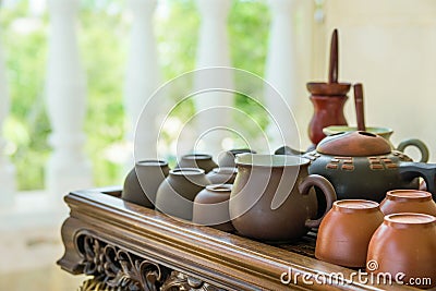 Set of Chinese Japanese Tea Cups Pot Bowls Utensils on Bamboo Wooden Tray on Cottage Terrace. Preparing Ceremony. Cozy Atmosphere Stock Photo