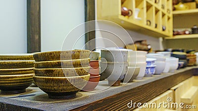 Set of clay cups in tea store. Shop of traditional tea crockery Stock Photo