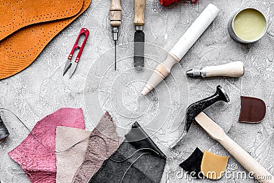 Set of cobbler tools on grey stone desk background top view Stock Photo