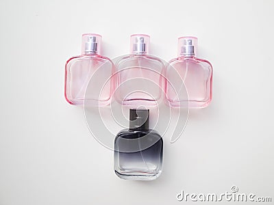 Set of colored cosmetic bottles, ampoules, tubes, cans on a white background. Pink bottles with flowers, aroma concept Stock Photo