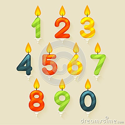 Set of colored glossy birthday cake candles. Isolated on bright background with fire flame. Stock Photo