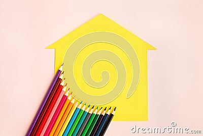 Set of Colored pencils on a yellow house Stock Photo