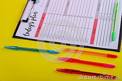 Set colorful pens and week calendar close-up. Stock Photo