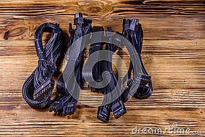 Set of computer psu cables on a wooden background Stock Photo