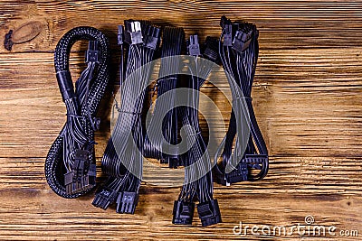 Set of computer psu cables on a wooden background Stock Photo