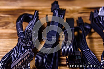 Set of computer psu cables on a wooden background Stock Photo