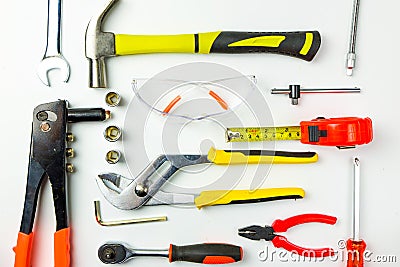 Set of construction tools on white background as wrench, hammer, pliers, socket wrench, spanner, tape measure, electric Stock Photo