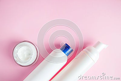 Set of cosmetics for skin care and cleansing on pink background. The concept of purity and body health. Place for text Stock Photo