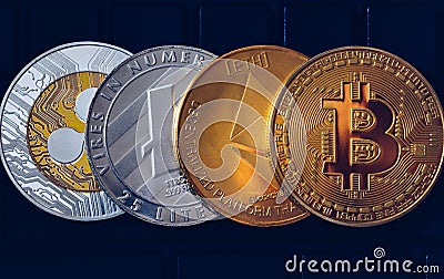 Set of cryptocurrencies with Bitcoin, Etherium, Ripple, Litecoin. Cryptocurrencys new digital money. Bitcoin on the front as the Editorial Stock Photo