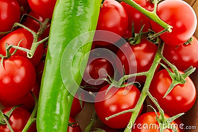 Set culinary base bright juicy tomatoes pod of hot pepper. Background design of a green pod piece on a background of tomatoes on a Stock Photo