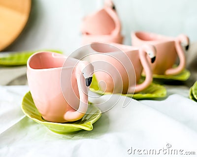 Set of decorative mugs and saucers on a white background Stock Photo