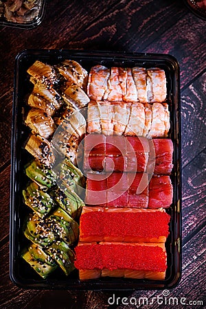 A set of delicious sushi rolls, sushi rolls in a disposable large set Stock Photo