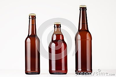 Set of different brown beer bottles 500ml and 330ml mock up. Template for advertising, design, branding identity on white wood ta Stock Photo