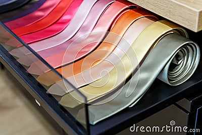 Set of different color skinny neckties in a men clothing store Stock Photo