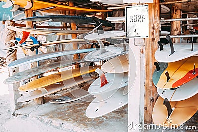 Set of different colorful surf boards in a stack Stock Photo