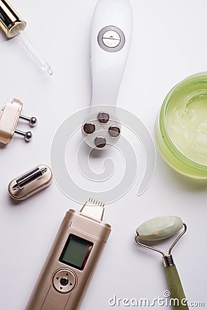 Set of different hardware equipment with vacuum jars, nephrite roll and massage brush. anti-age and anti-cellulite set for home Stock Photo