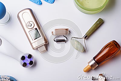 Set of different hardware equipment with vacuum jars, nephrite roll and massage brush. anti-age and anti-cellulite set for home Stock Photo