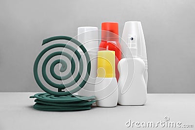 Set of different insect repellents on grey background Stock Photo