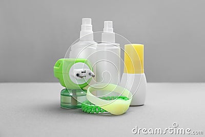 Set of different insect repellents on grey background Stock Photo