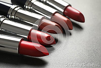 Set of different lipsticks on grey background Stock Photo