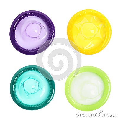Set with different unpacked condoms on white background, top view Stock Photo