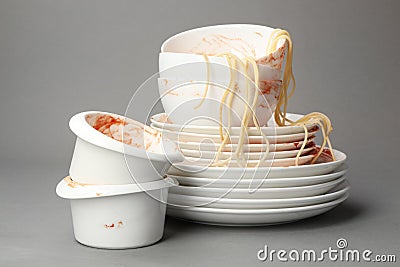 Set of dirty dishes with spaghetti leftovers Stock Photo