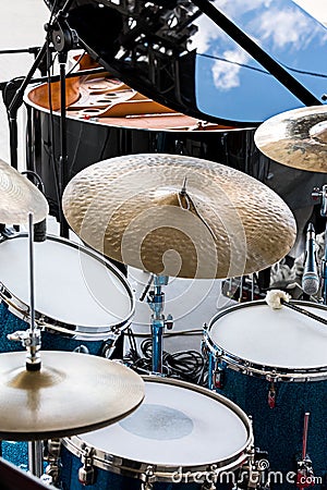 Set of drums, microphones and wires on stage before performance Stock Photo