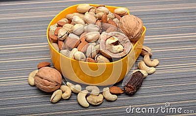 Set of Dry Fruits in a Bowl & Coconut Shell Stock Photo