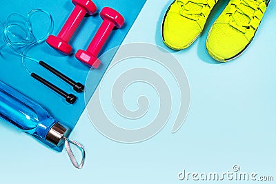 Set with dumbbells, bottle of water and sneakers. Stock Photo