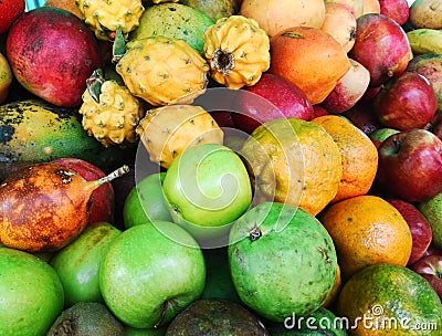 Set of exotic and colorful tropical fruits: including apple, orange, mango Stock Photo