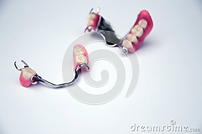 Set of fake teeth on a light background. dental prosthetics concept. removable prosthetics. dentistry Stock Photo