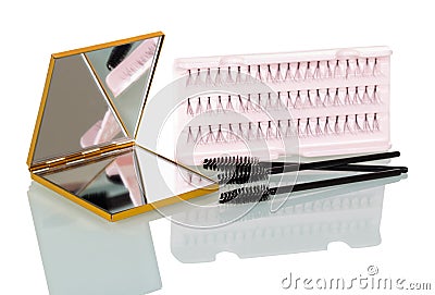 A set of false eyelashes bunches, brush for applying mascara and Stock Photo