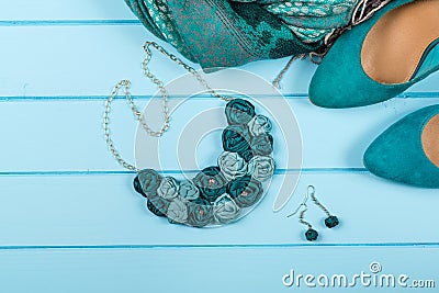 Set of fashionable women`s acsessories on blue wooden background Stock Photo