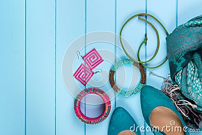 Set of fashionable women's acsessories on blue wooden background Stock Photo