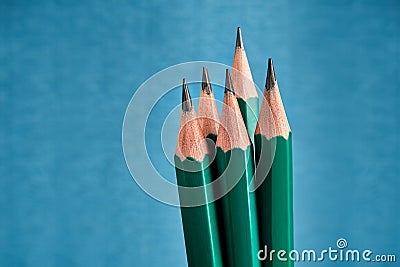 Five identical lead graphite pencils with sharp sharpening, blue Stock Photo