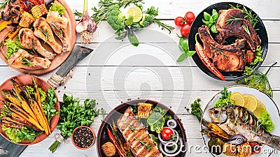 A set of food. Steak, Fish, Vegetables and Spices. On a wooden background. Stock Photo
