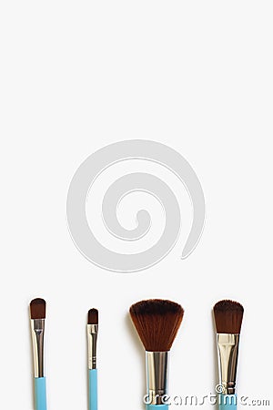 A set of four makeup brushes of different shapes on a white background Stock Photo