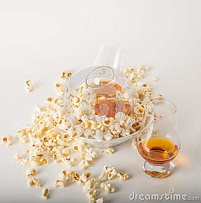 Set of glasses of single malt whisky, salty popcorn in a bowl an Stock Photo