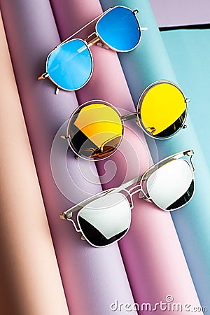 Set of gold silver and blue Filter for lenses of UV protection sunglasses on pastel color of roll background, Beautiful Eye glasse Stock Photo