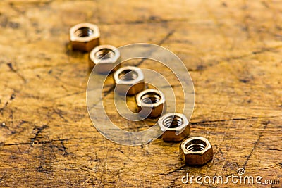 Set of golden nuts on wooden background Stock Photo