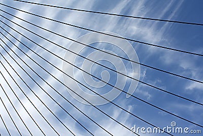 A set group of steel wire lines with a blue sky background Stock Photo