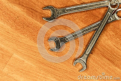 Set of hand tools three wrenches used to fix bolts lies ha wooden background Stock Photo