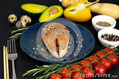 A set of healthy balanced super food, Salmon steak on a beautiful blue plate, vegetables Stock Photo