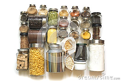 Set of homemade stocks of spices, cereals, coffee , pasta, flour, sugar on white table top. Storage and save in glass jar Stock Photo
