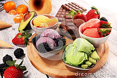 Set of ice cream scoops of different colors and flavours with berries, chocolate and fruits Stock Photo