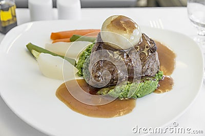 Set inflight meal steak on a tray, on a white table Stock Photo