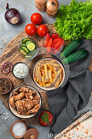 A set of ingredients for making shawarma, tacos on a gray background. Stock Photo